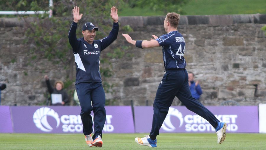 Con de Lange gives Richie Berrington a high-five for taking the wicket of Gerhard Erasmus
