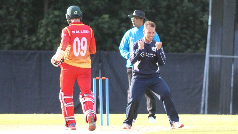 Con de Lange celebrates his fifth wicket after Malcolm Waller is caught on the boundary