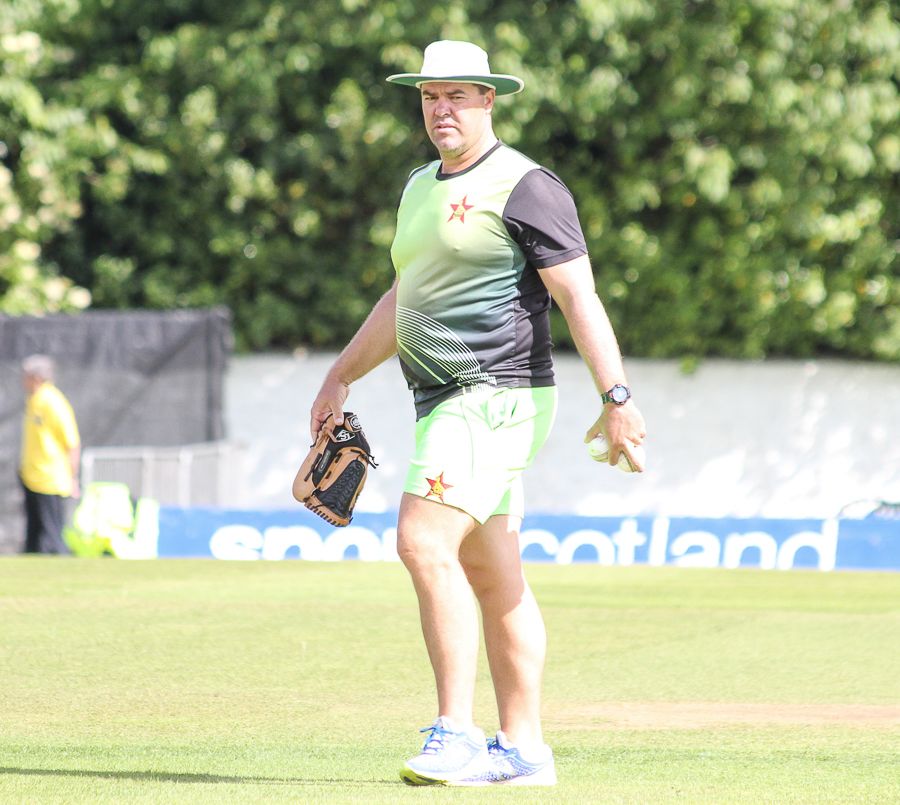 Zimbabwe coach Heath Streak sets up some markers during warm-ups