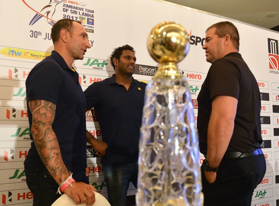 Nic Pothas, Angelo Mathews and Heath Streak chat at a press conference