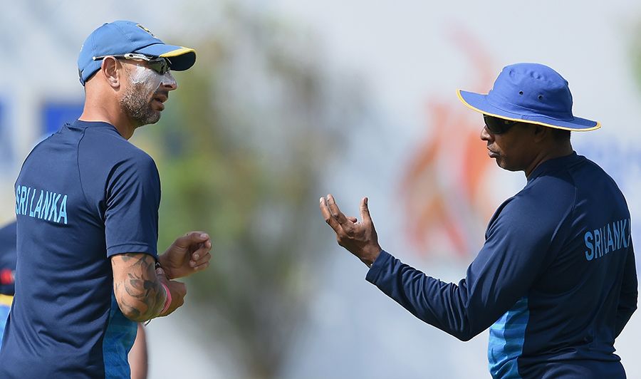 Sri Lanka's interim coach, Nic Pothas, and fast-bowling coach, Chaminda Vaas, supervise a training session