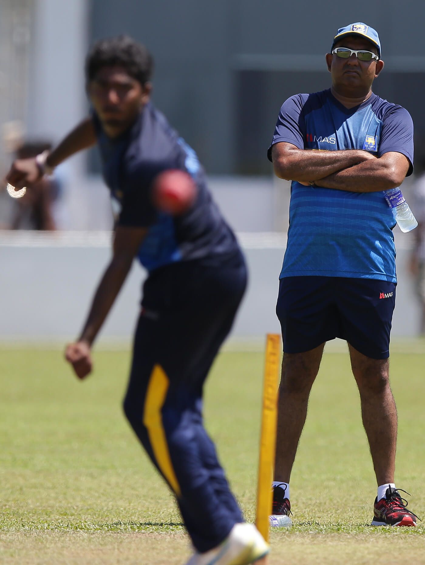 Asanka Gurusinha watches Lakshan Sandakan bowl