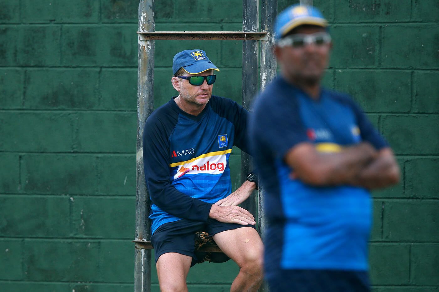 Coach Graham Ford and manager Asanka Gurusinha watch the training session