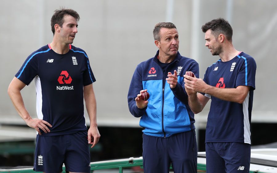 Toby Roland-Jones and James Anderson gets some tips from Dominic Cork
