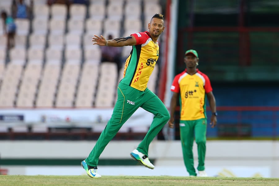 Rayad Emrit celebrates the wicket of Marlon Samuels