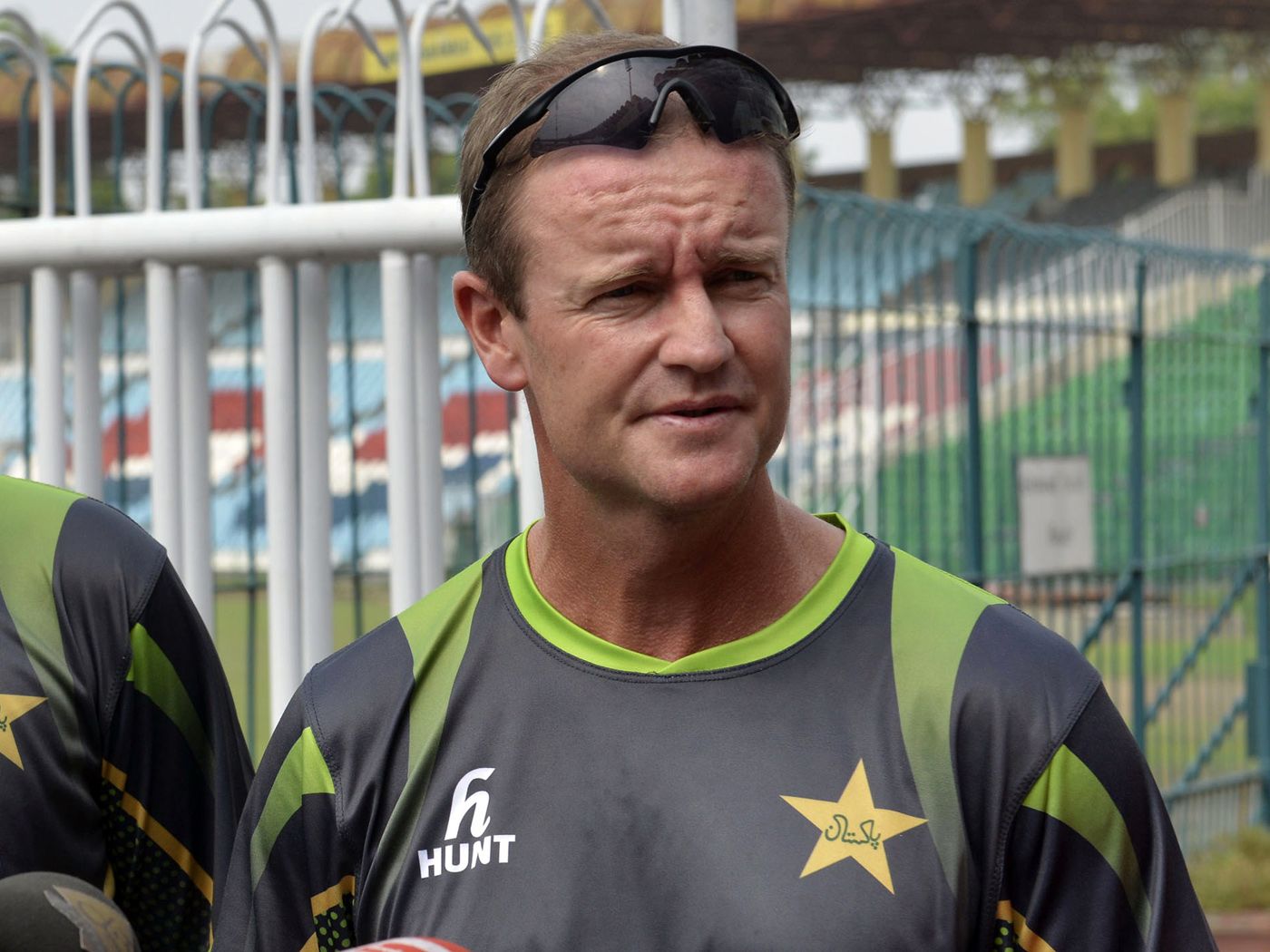 Grant Flower addresses the media in Lahore