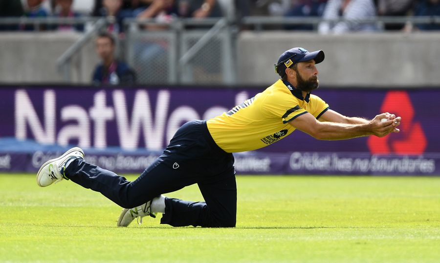 Grant Elliott lunges to hold on to a catch