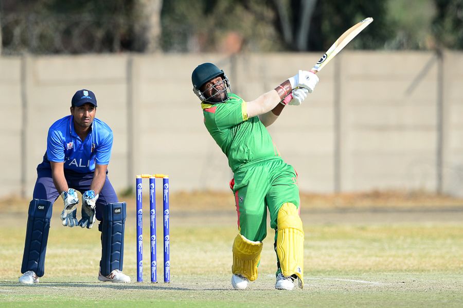 Patrick Matautaava drives down the ground during his 83 off 60 balls