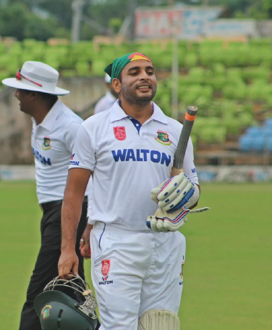 Tushar Imran walks off after hitting a century