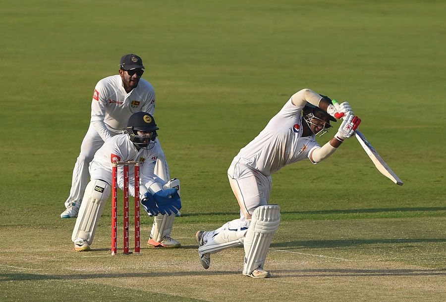 Sami Aslam gets down the pitch to drive
