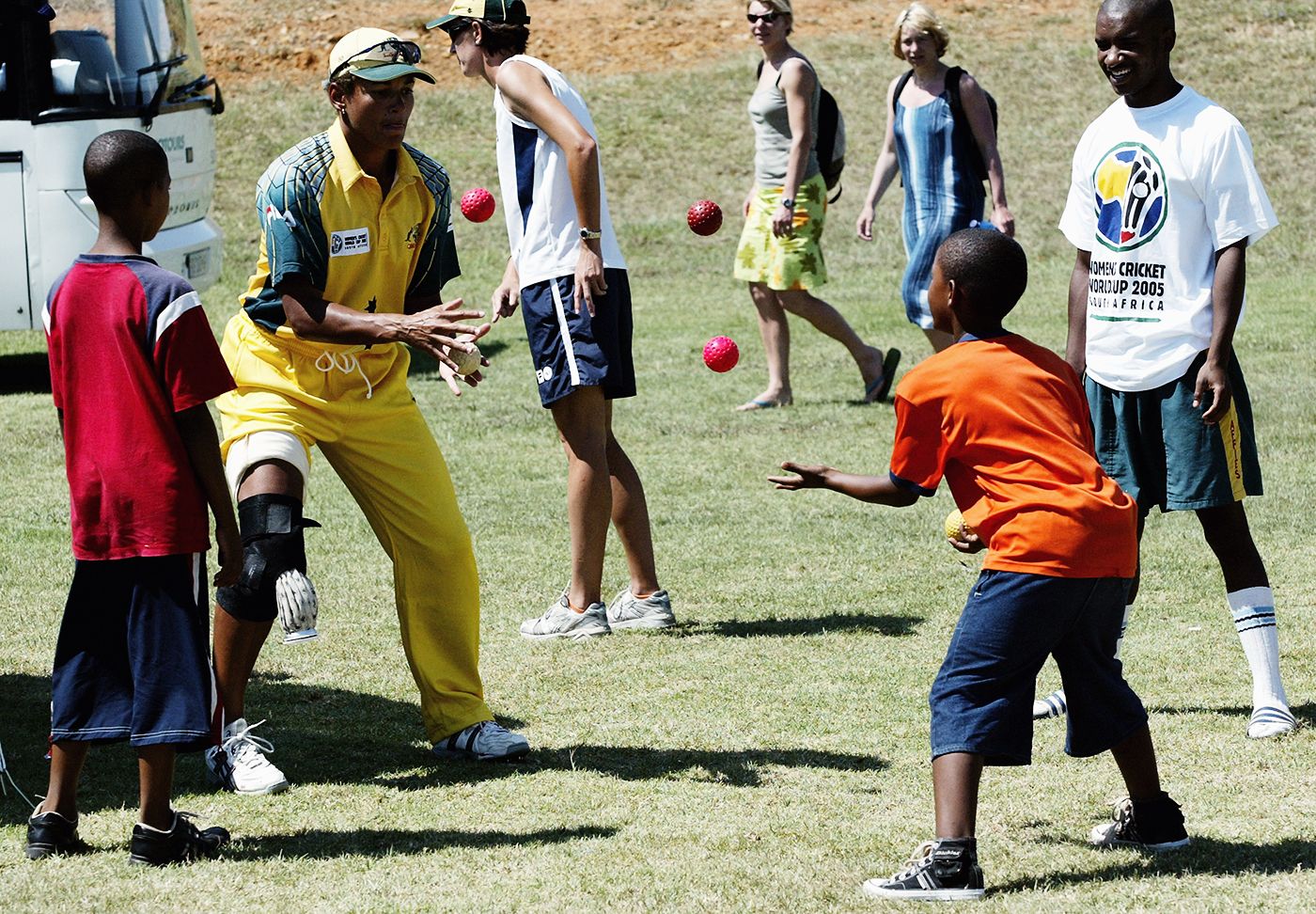 Australia's Mel Jones plays catch with kids ahead of the World Cup game in Pretoria