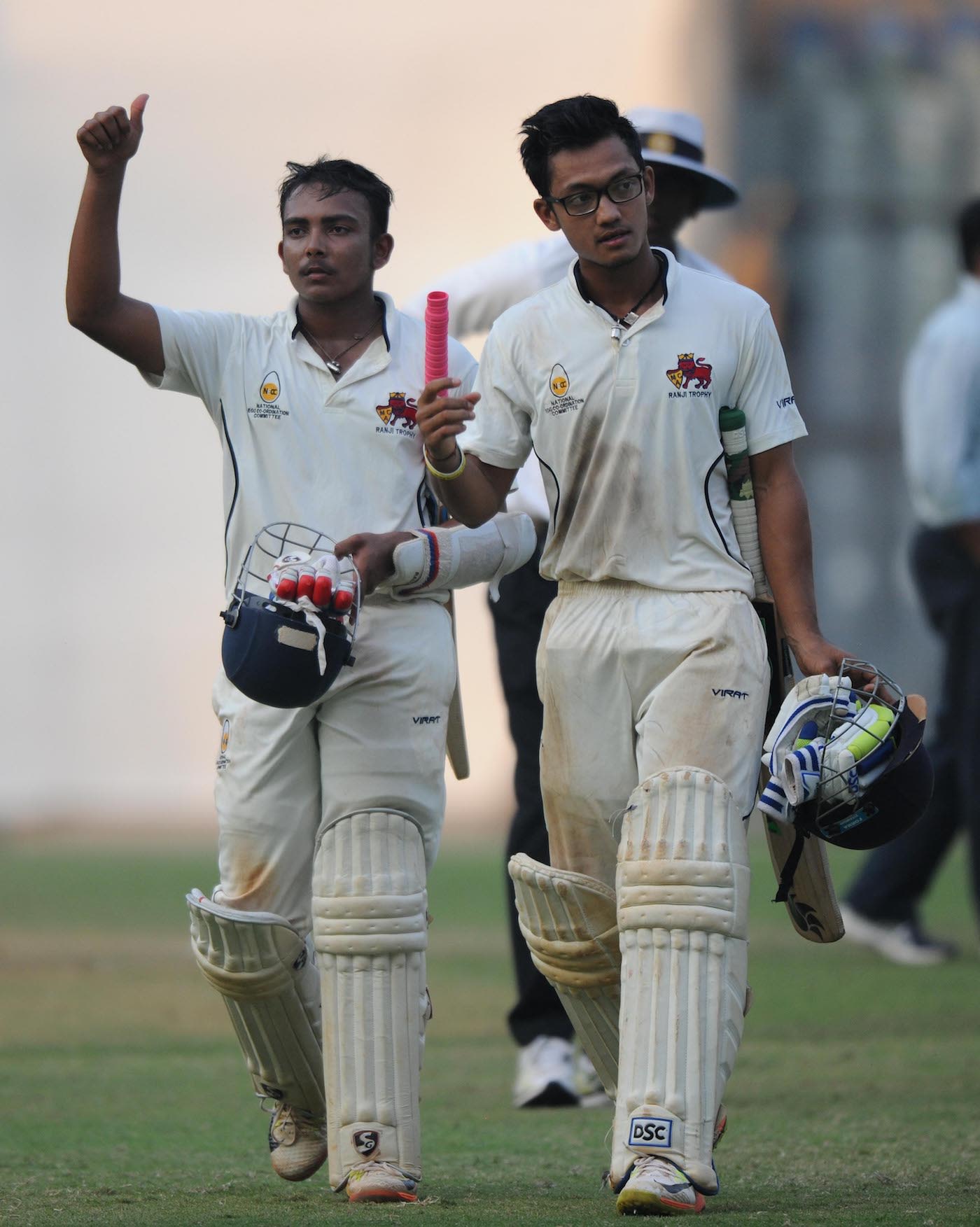 Prithvi Shaw and Jay Bista walk back after sealing Mumbai's win