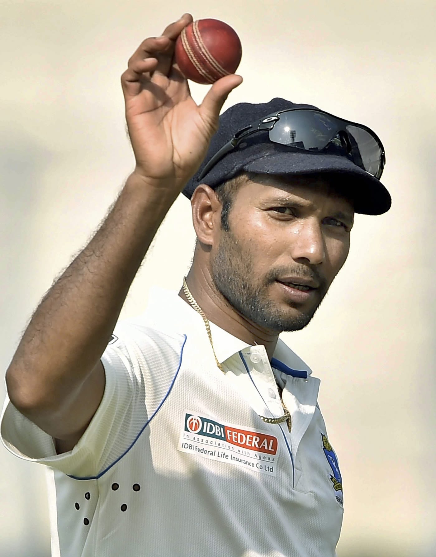 Ashok Dinda celebrates with the match ball
