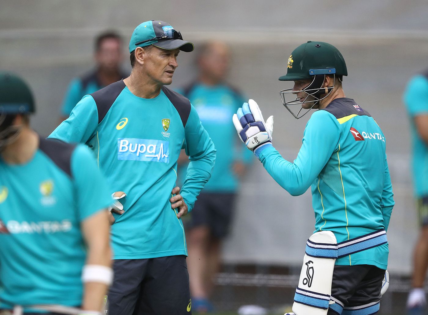 Australia batting coach Graeme Hick chats with Pete Handscomb at a training session