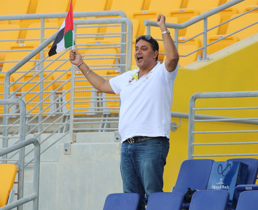 One of the few UAE fans present, Bobby Suri cheers on his son Chirag