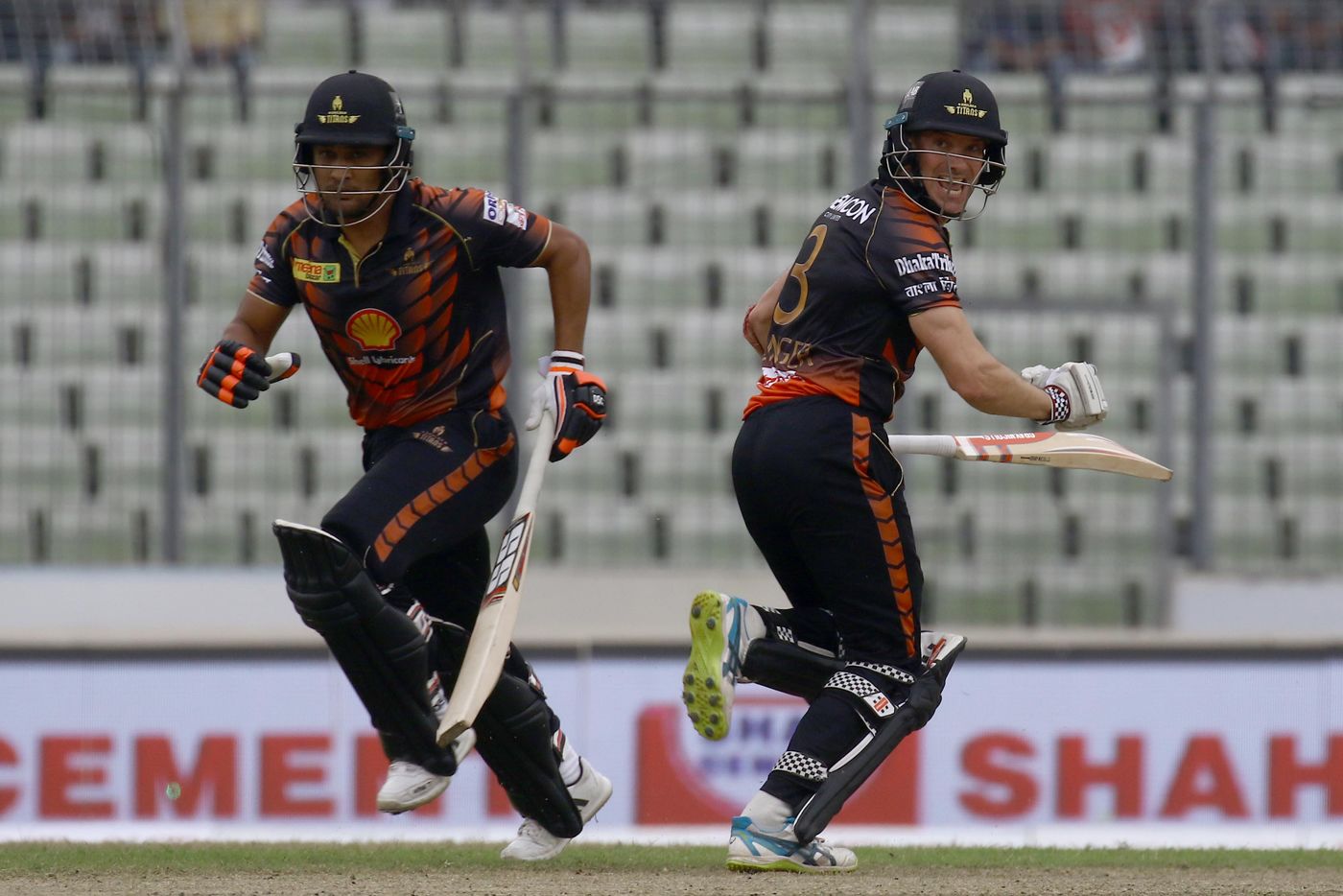 Michael Klinger and Ariful Haque run between the wickets