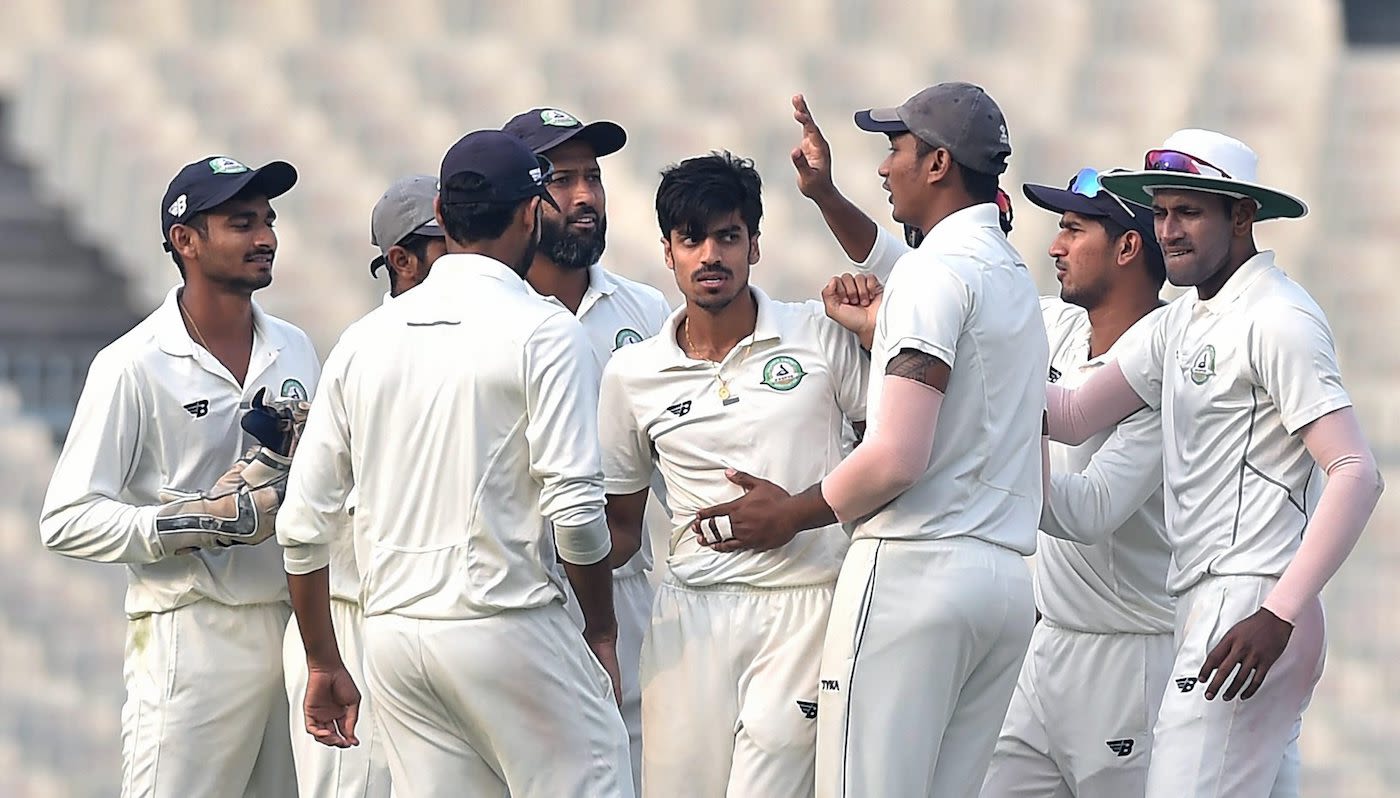 Rajneesh Gurbani is congratulated by his team-mates