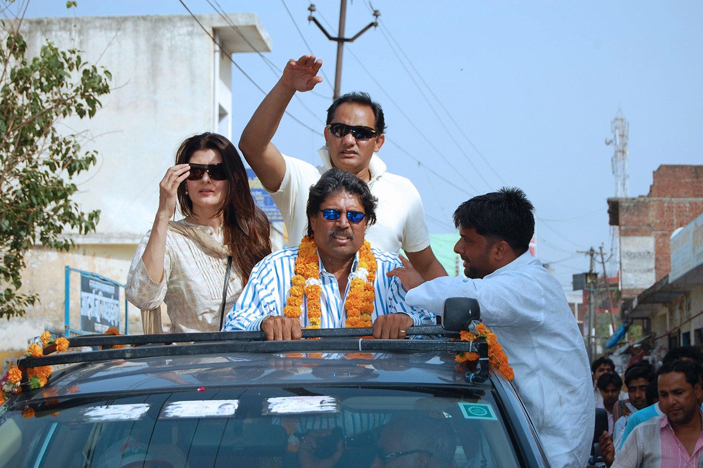 Mohammad Azharuddin (centre, top) campaigns ahead of the general election