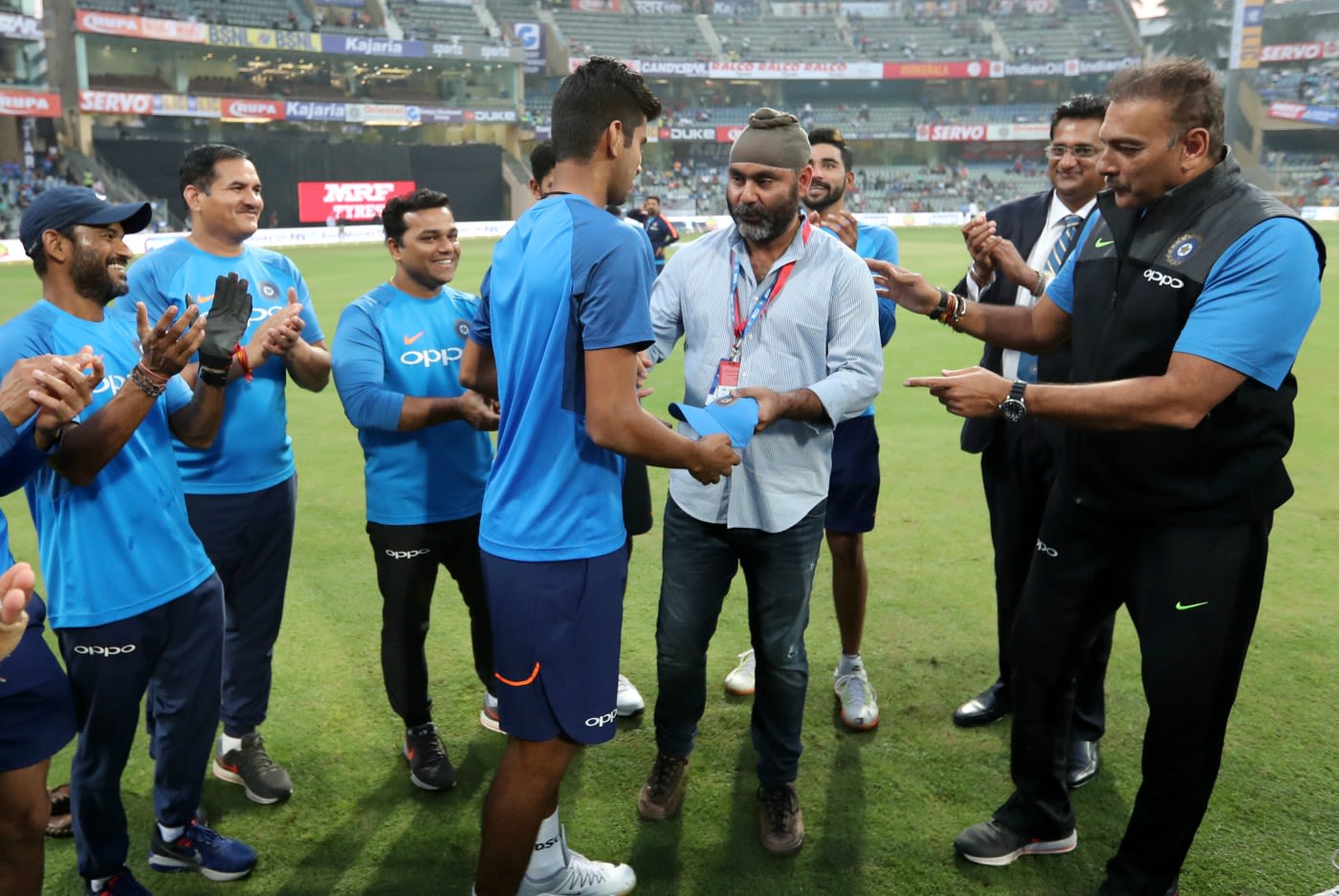 Washington Sundar receives his T20 cap from Sarandeep Singh