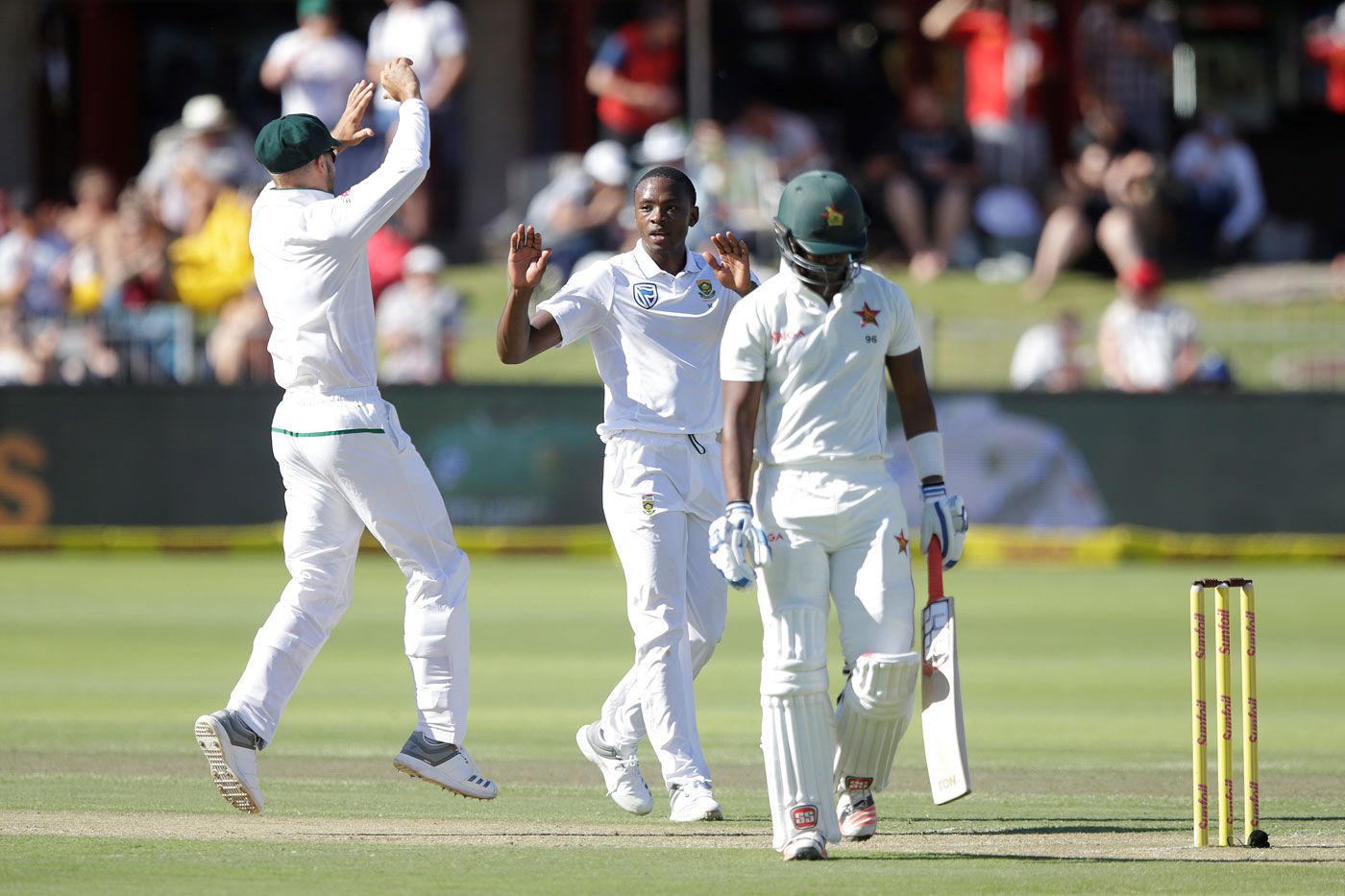 Kagiso Rabada celebrates the wicket of Chamu Chibhabha