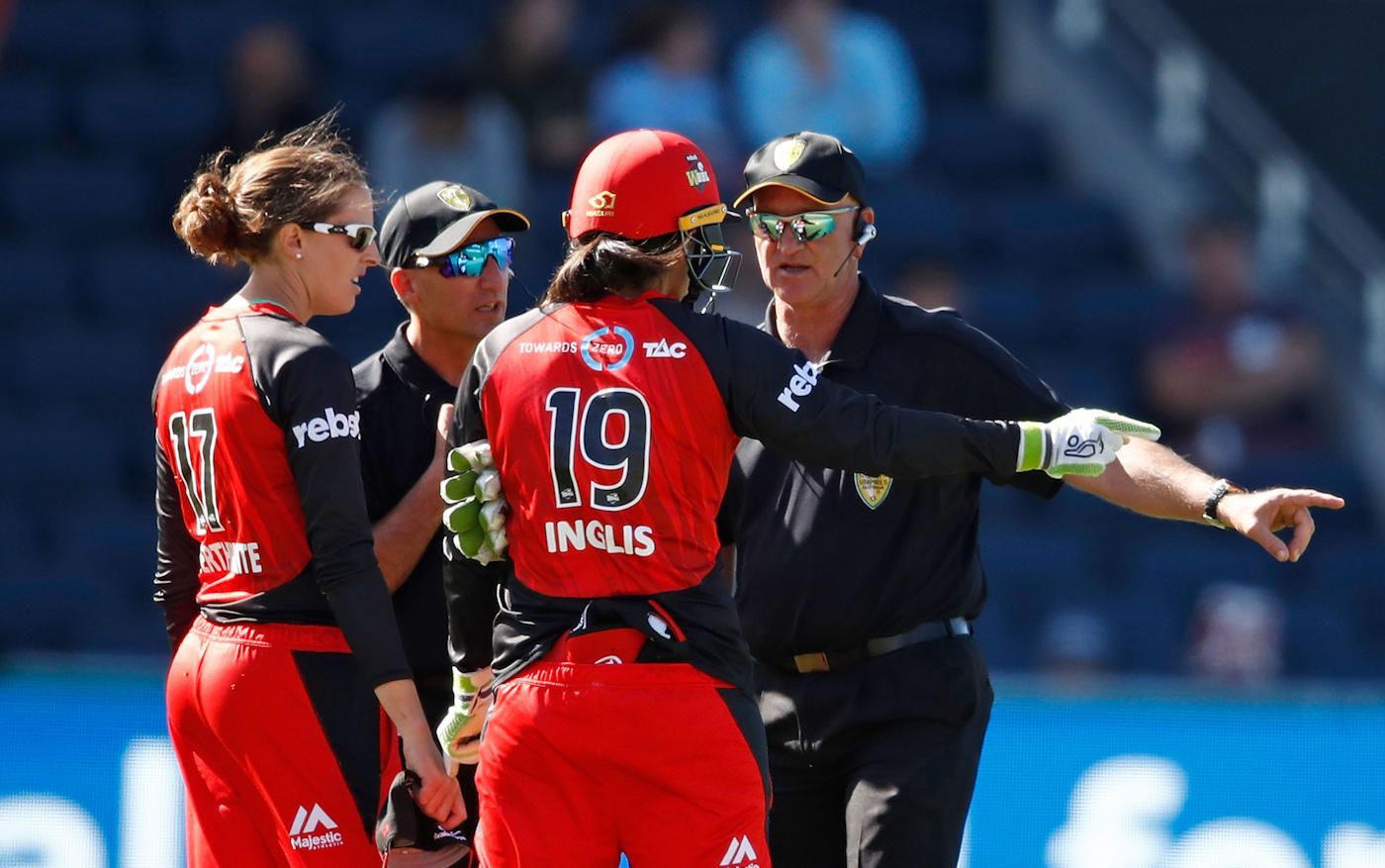 Amy Satterthwaite and Sarah Inglis debate with the umpires