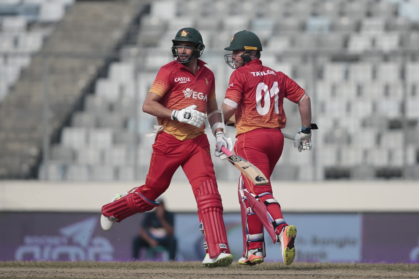 Brendan Taylor and Graeme Cremer run between the wickets