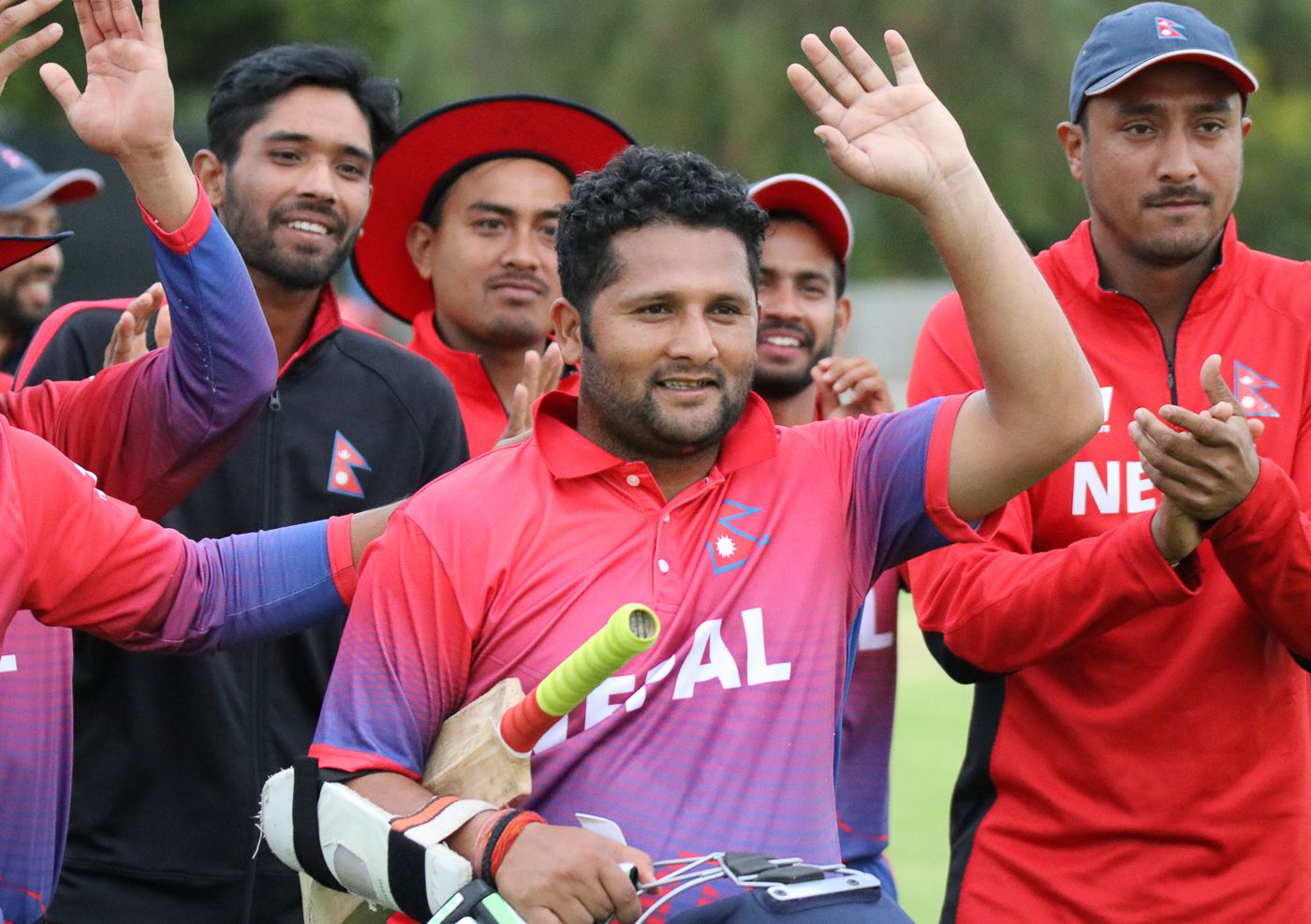 Basant Regmi walks off to applause from his team-mates after his 24 not out secured victory