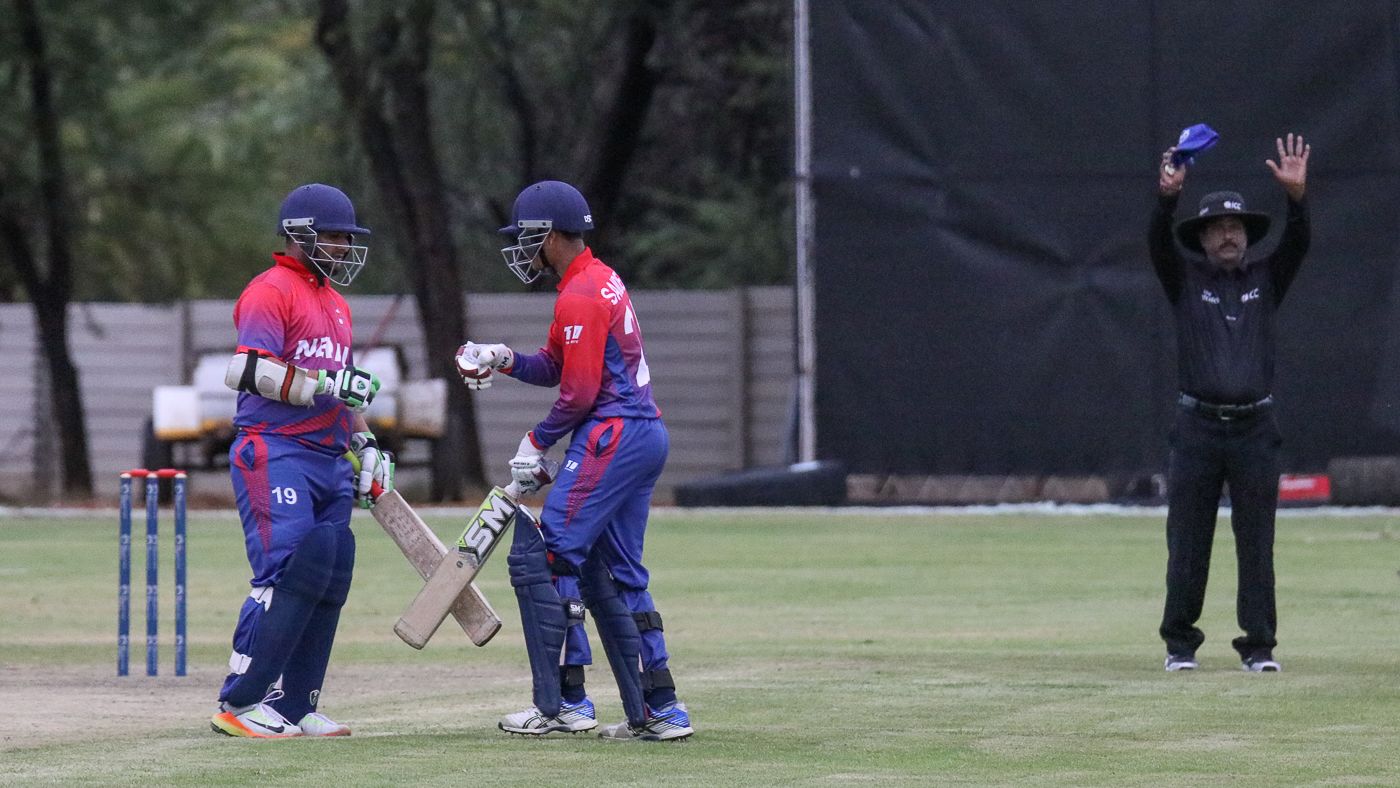 Basant Regmi punches gloves with Sandeep Lamichhane after smashing a crucial six