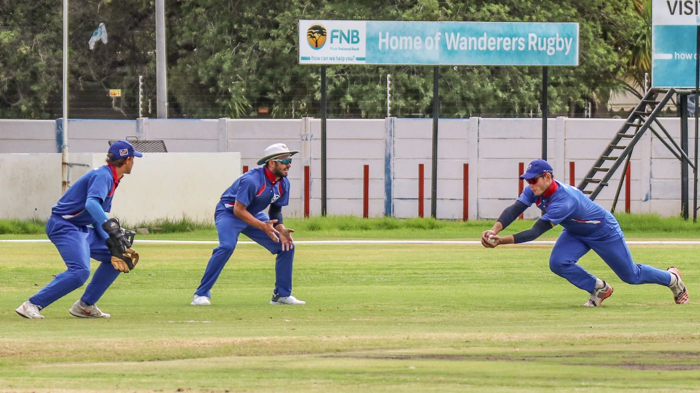 Stephan Baard moves right to take a sharp low catch at gully for another Sarel Burger wicket