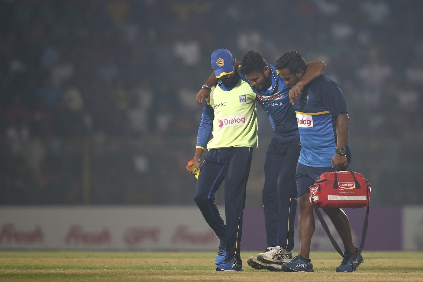 Shehan Madushanka is helped off the field