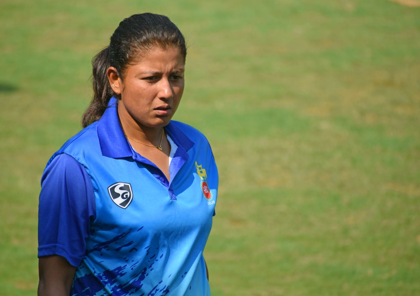 Rumeli Dhar heads towards the Delhi dugout during the Senior Women's T20 league