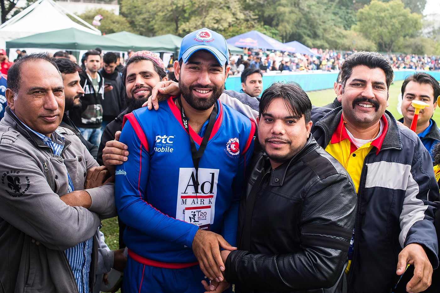 Babar Hayat poses with fans for photos while playing for Kowloon Cantons in a Hong Kong Blitz match