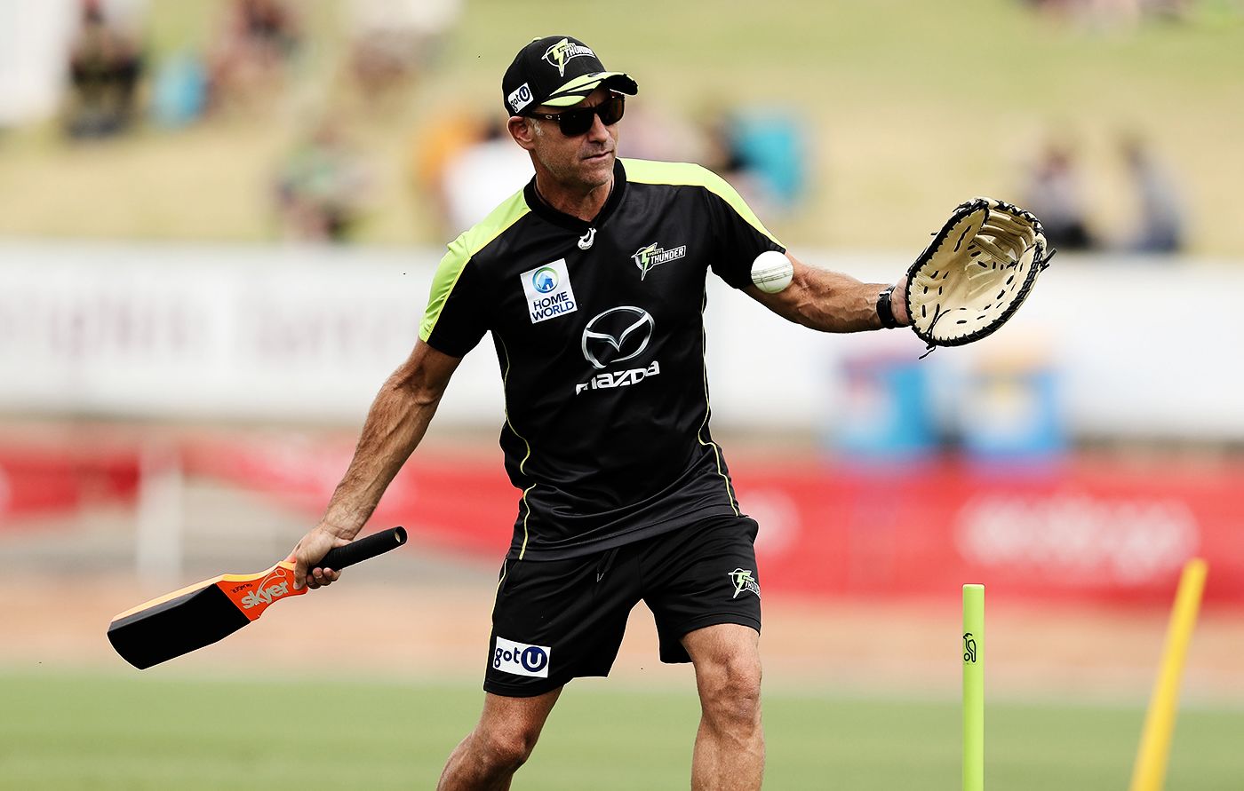 Sydney Thunder coach Paddy Upton hits a ball