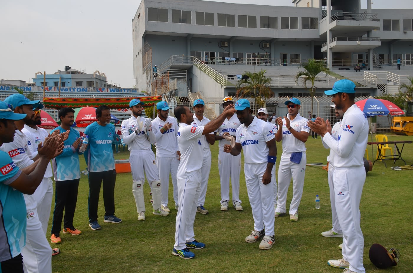 Salauddin Sakil receives his cap from Mohammad Sharif
