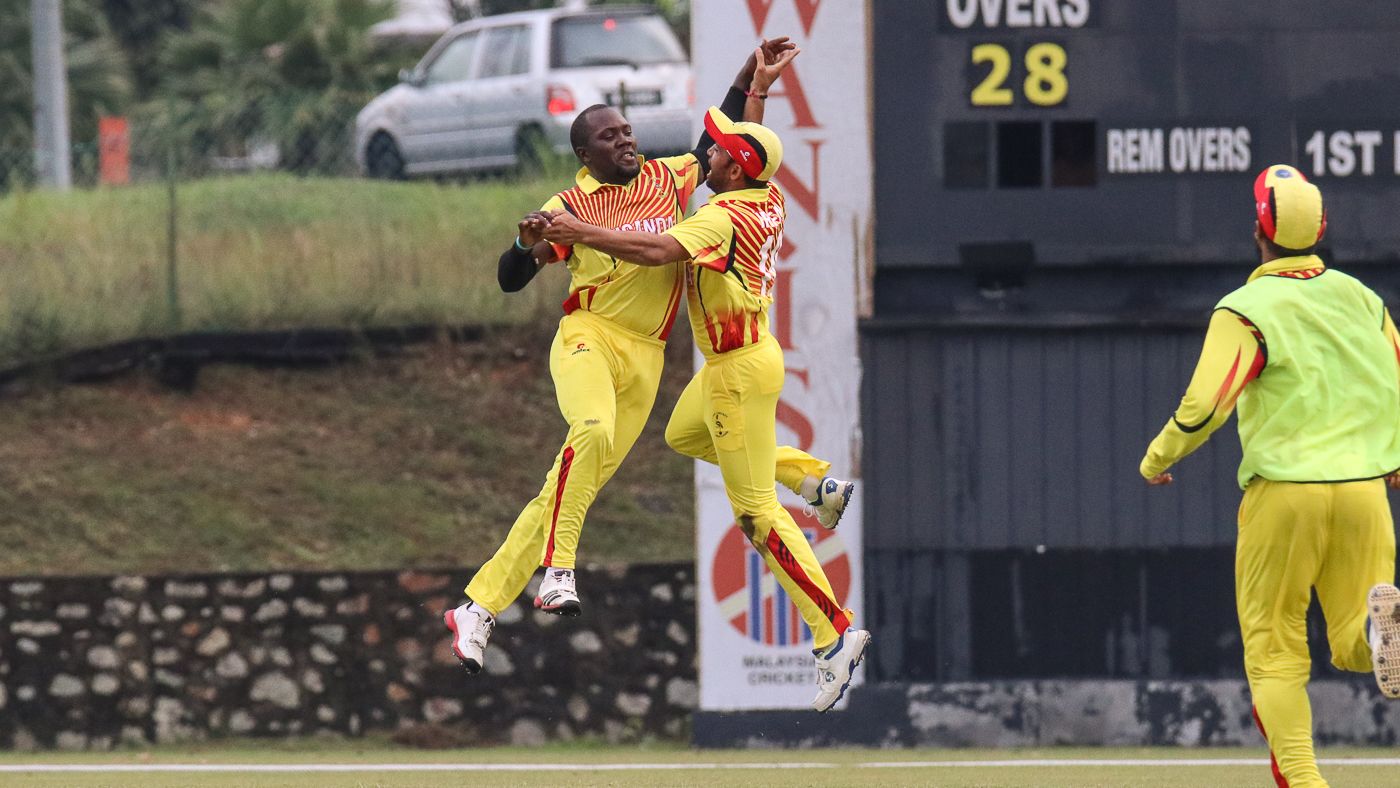 Uganda captain Roger Mukasa and Irfan Afridi leap for joy after a thrilling last-ball win