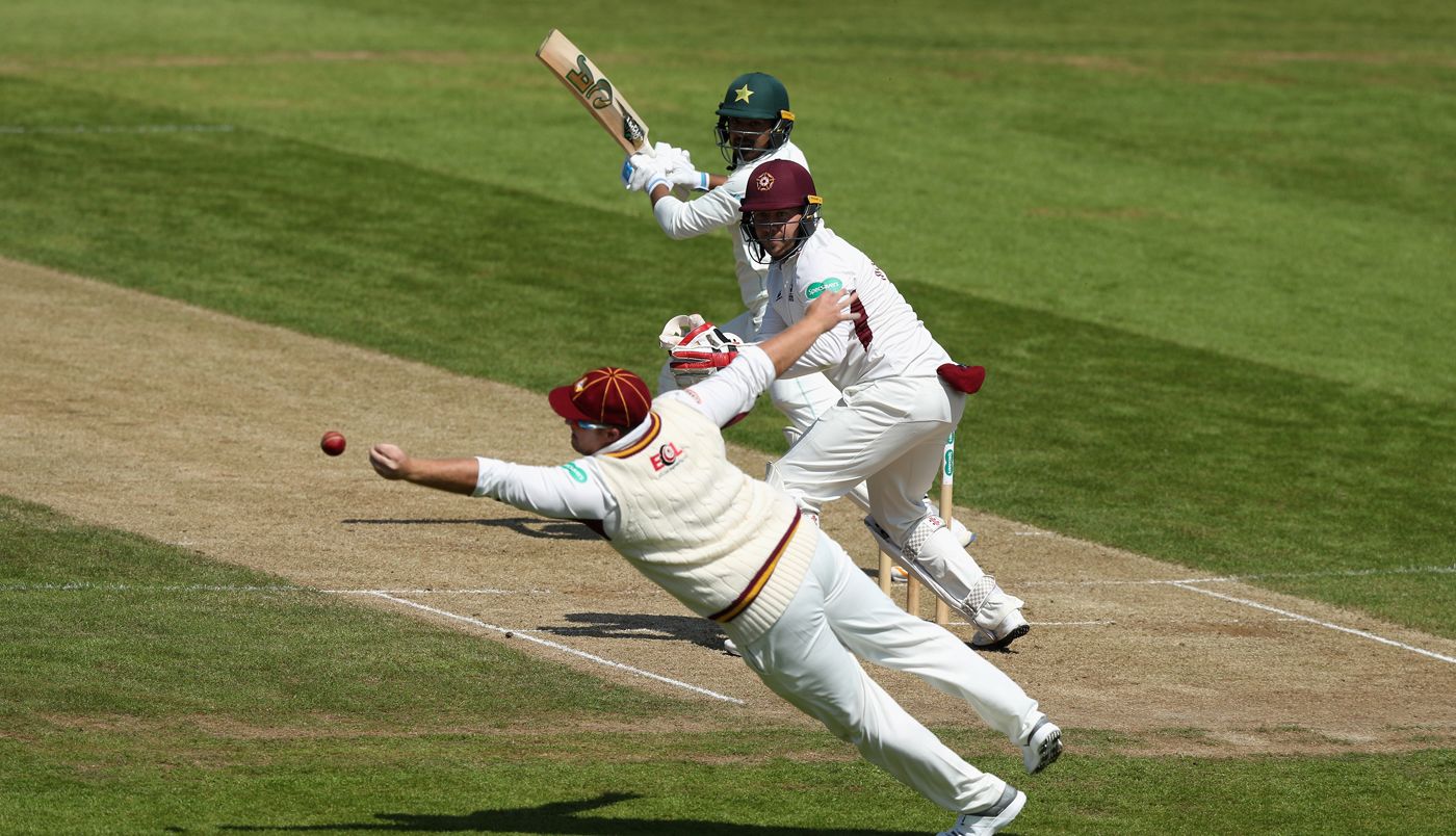 Richard Levi dives in an attempt to catch Haris Sohail