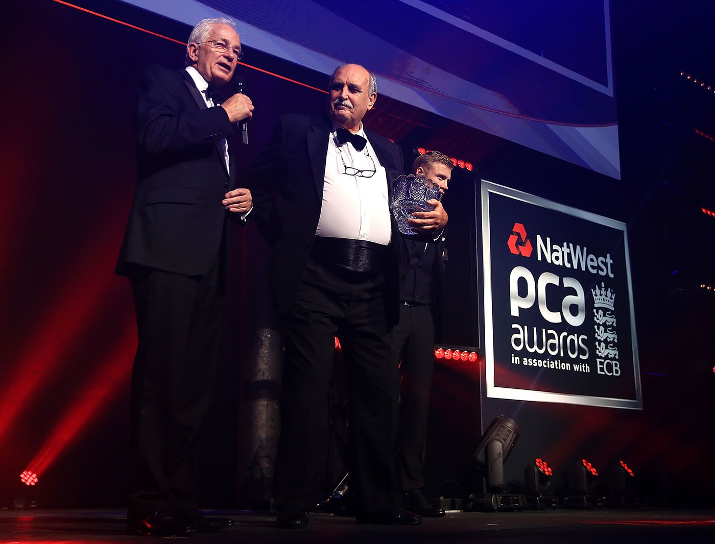 Fred Rumsey receives a lifetime achievement award from the PCA