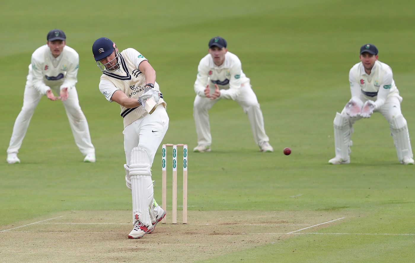 Ollie Rayner works the ball away