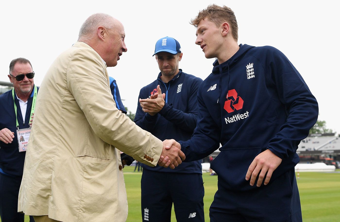 Vic Marks hands fellow Somerset spinner Dom Bess his cap