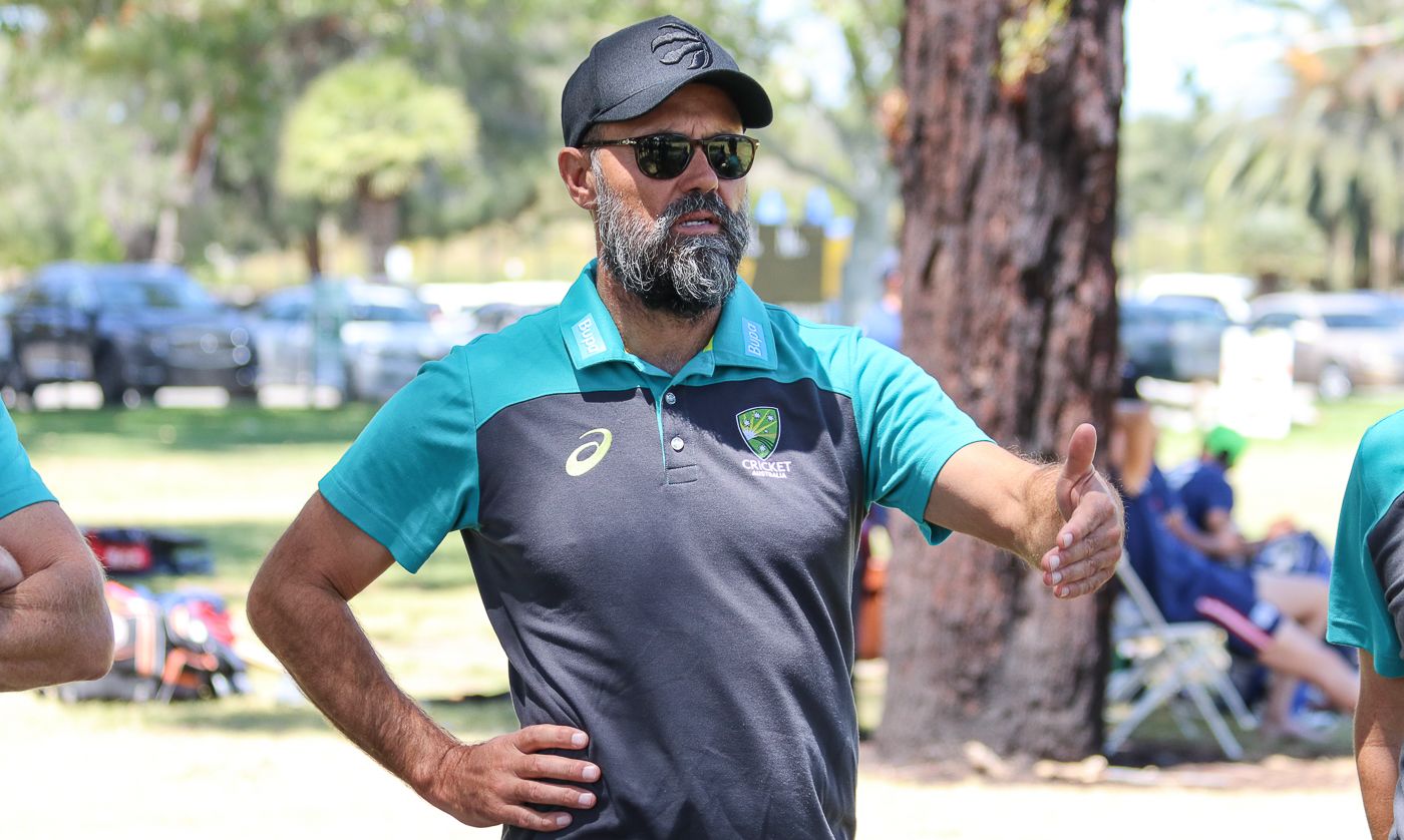 Australia spin bowling coach John Davison offers some tips at a trial match
