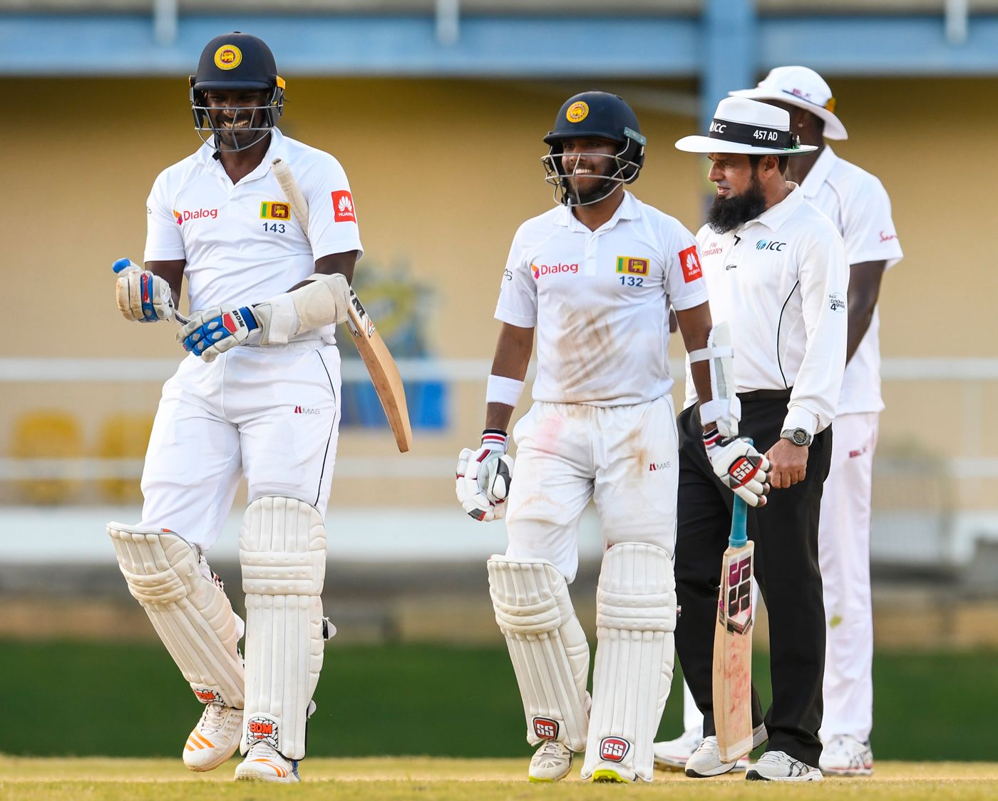 Lahiru Gamage and Kusal Mendis share a laugh