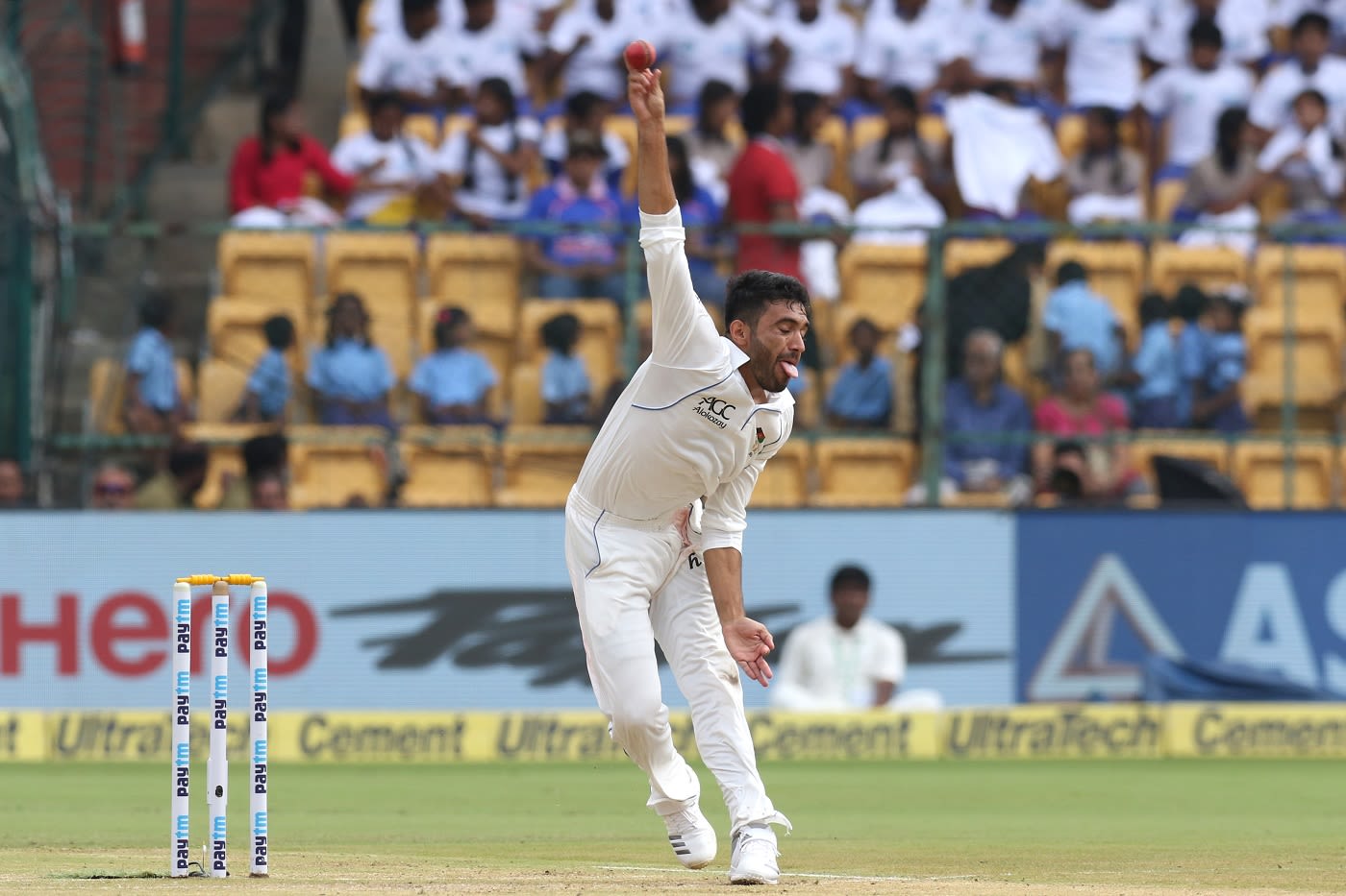 Yamin Ahmadzai is a picture of exertion as he delivers the ball