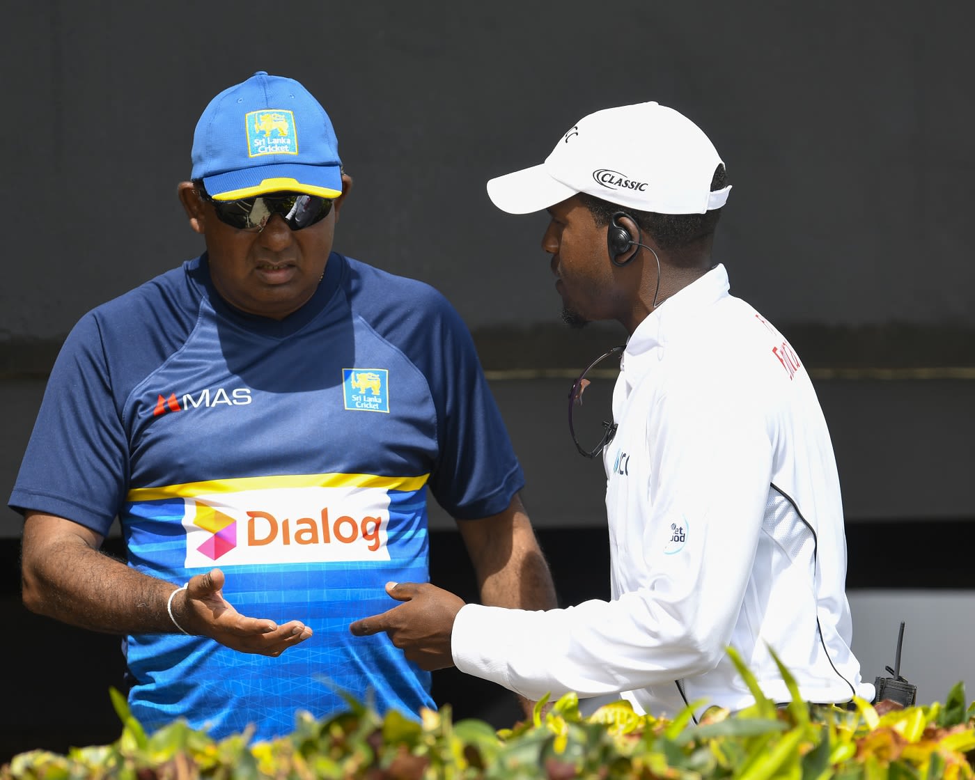 Sri Lanka team manager Asanka Gurusinha speaks with a match official