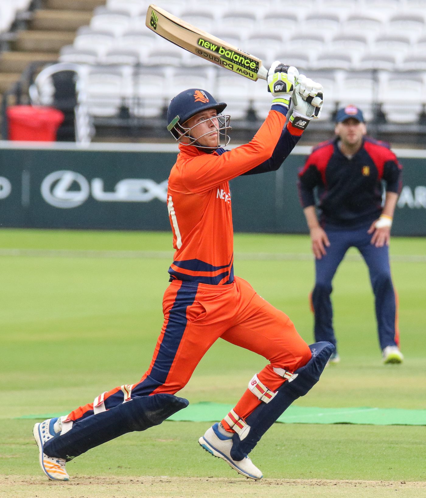 Tobias Visee drives a six over cover to bring up his half-century