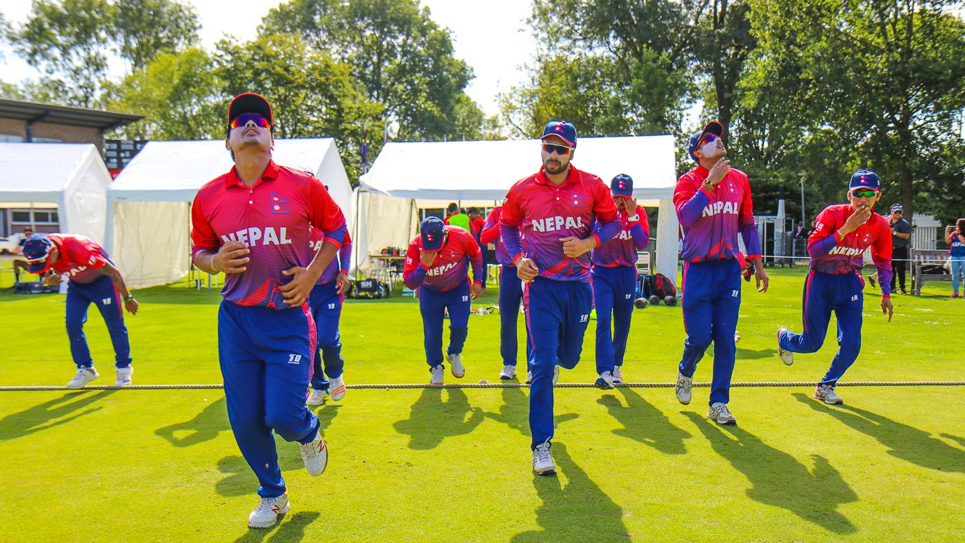 Nepal run onto the field for the start of play in their maiden ODI