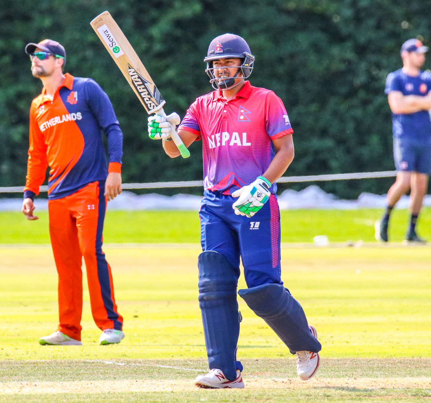 Gyanendra Malla raises his bat after notching Nepal's maiden ODI half-century