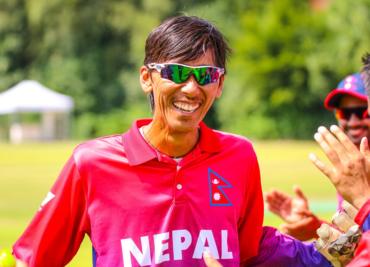Shakti Gauchan walks through the guard of honor formed by his teammates