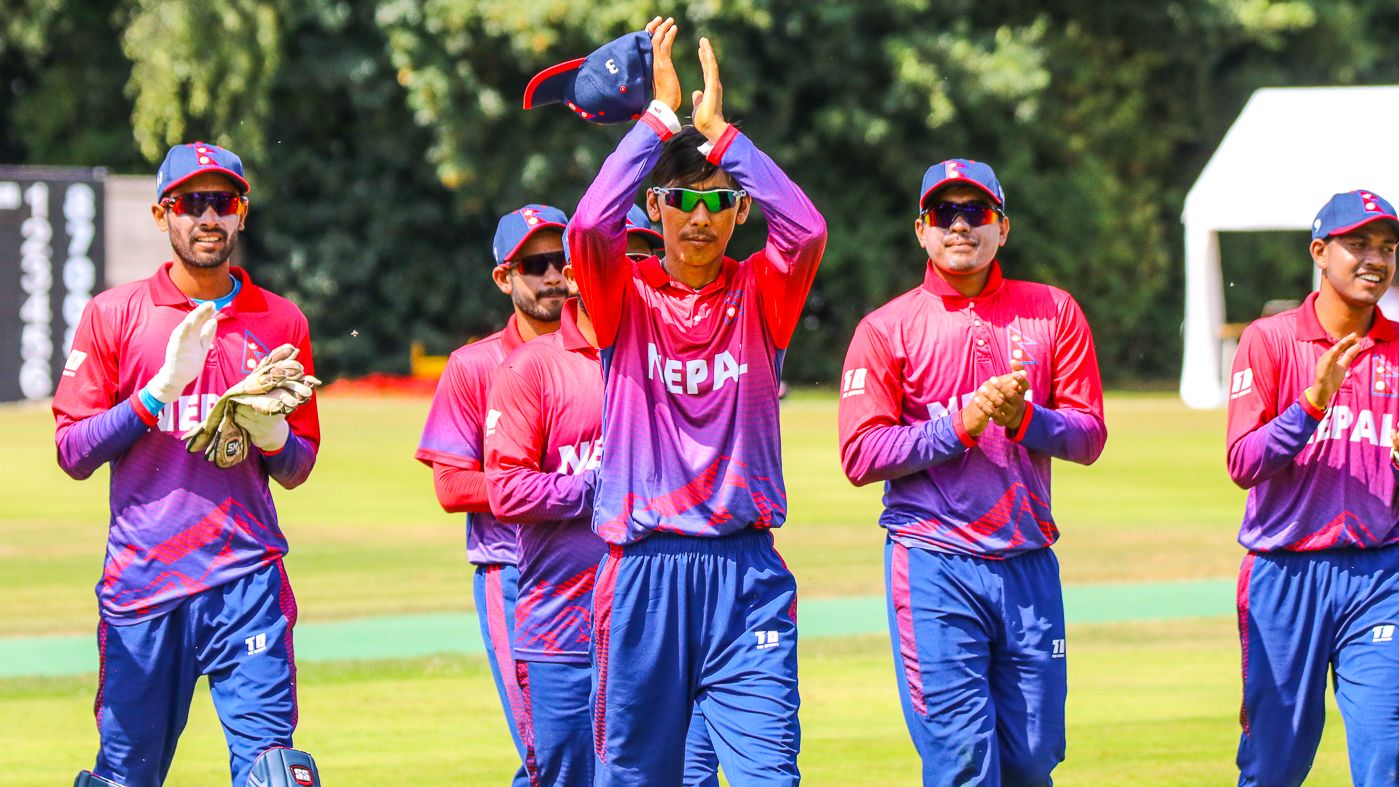 Shakti Gauchan thanks the fans as he leads the team off the field in Nepal's maiden ODI