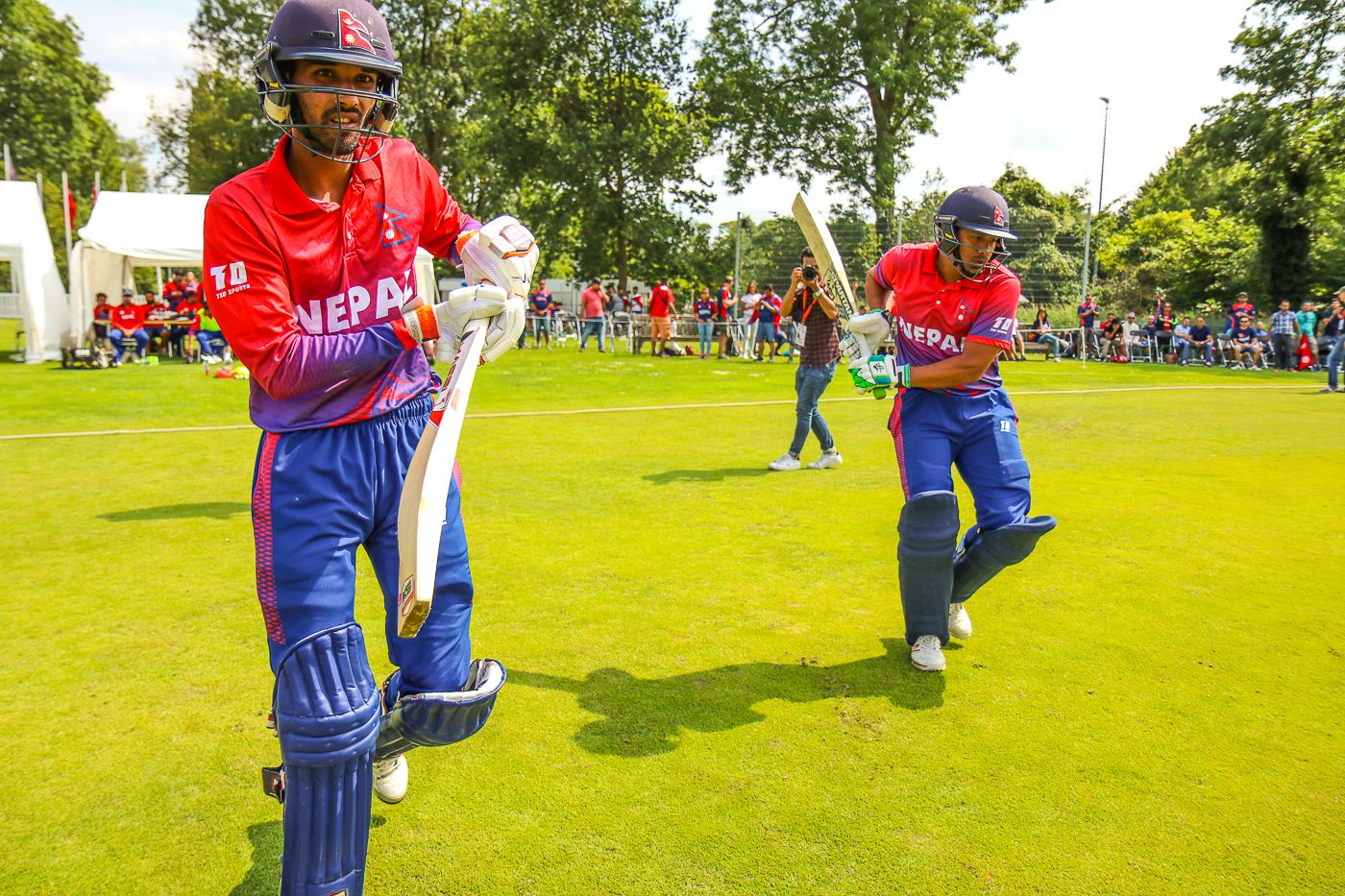 Anil Sah and Gyanendra Malla walk out to open Nepal's maiden ODI innings