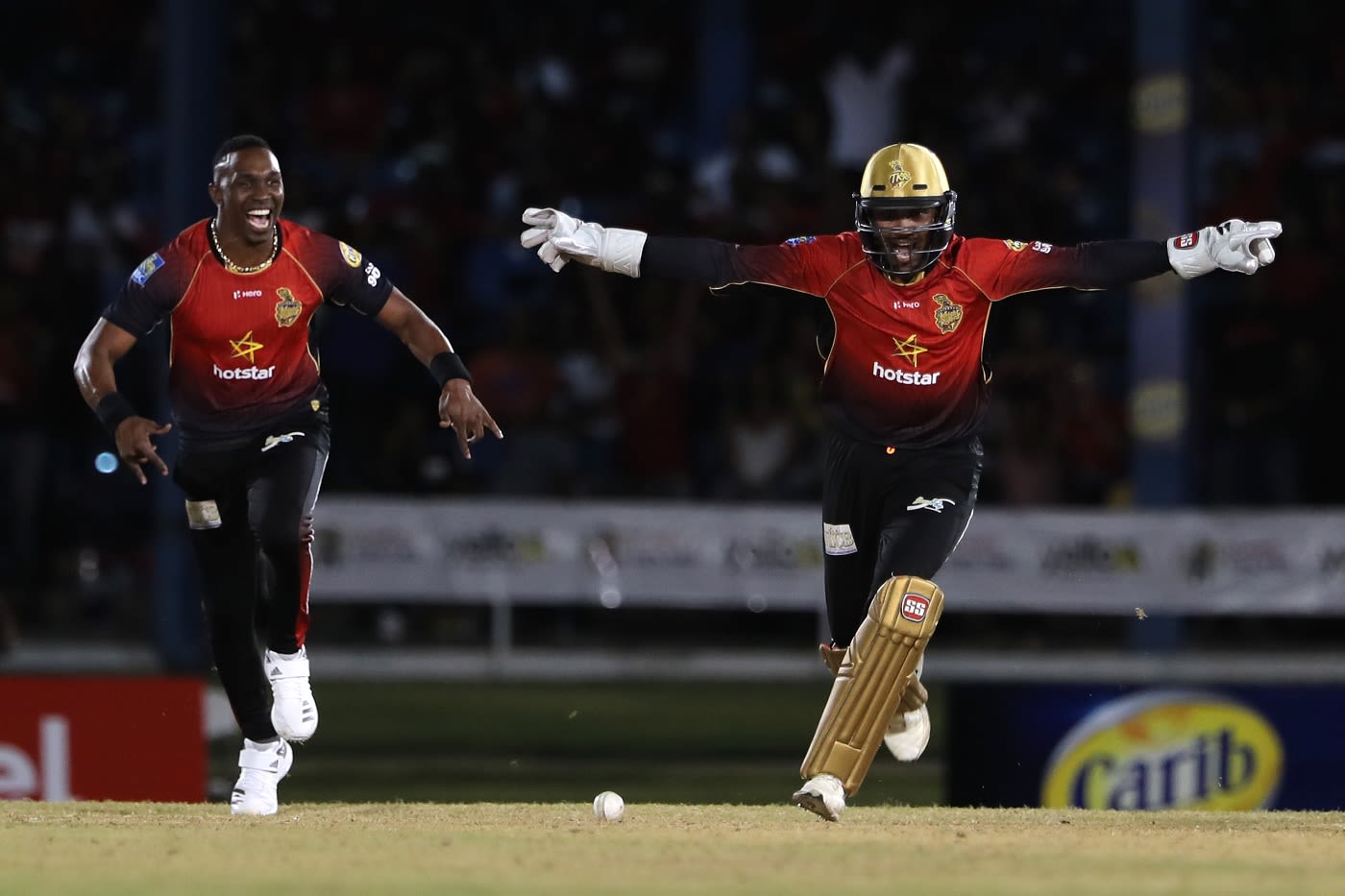 Dwayne Bravo and Denesh Ramdin celebrate a wicket